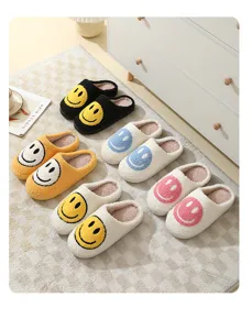 Fluffy house slippers for women and men, cute smiley face winter warm plush indoor shoes.