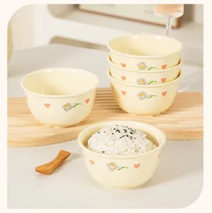 Cute cream style ceramic rice bowl set with lovely flower and heart patterns for home use.