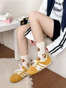 Cute teddy bear donut patterned mid-calf cotton socks for women, cozy autumn winter style.