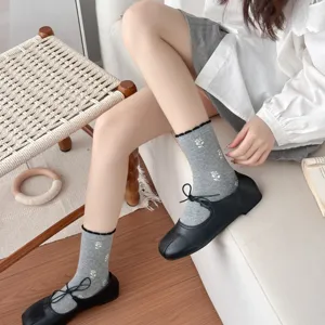 Women's grey mid-tube socks featuring white tulip floral pattern and cute ruffles.