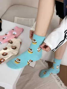 Detailed view of cute cartoon animal patterned mid-tube cotton socks in cozy winter style.