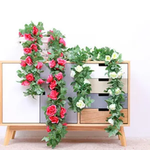 Artificial rose flower vine for balcony and home decor, realistic green plant rattan.