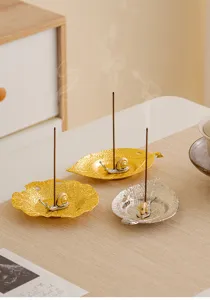 Creative leaf shaped metal incense burner with cute snail design for home desktop decor.
