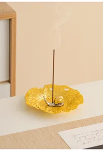 Modern creative metal lotus leaf incense burner with snail design for desktop decor.