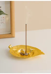 Modern creative leaf-shaped metal incense burner with a cute snail holder for home decor.