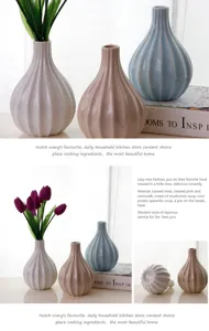 Ceramic vase detail view, Nordic vintage striped desktop flower arrangement decor piece.
