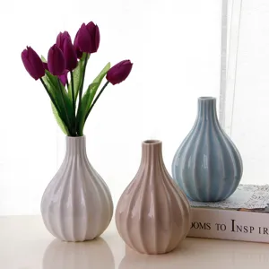 European minimalist style ceramic vase set with artificial tulip flowers for home decor.