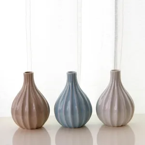 Set of 3 minimalist ceramic vases in pastel colors, retro gourd shape for home decor desktop.