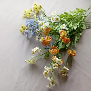 Close-up detail of colorful artificial daisy bouquet showing vibrant flower heads.
