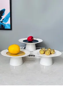 Modern minimalist ceramic cake stand with radiant pattern, elegant fruit plate for dessert.