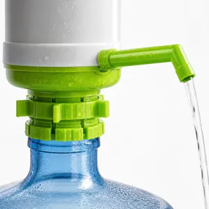 Manual water pump detail showing green spout and white press mechanism mounted on bottled water jug.