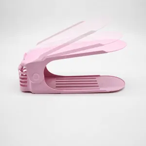 Pink adjustable plastic shoe rack organizer, side view showing three height levels for space saving.