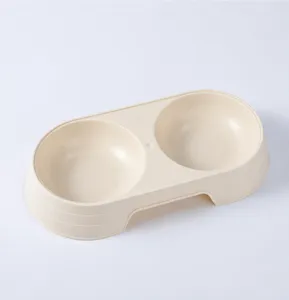 Close-up detail of the plastic double pet bowl featuring smooth curves and anti-overturn base.