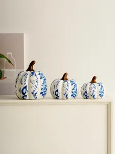 Exquisite blue and white porcelain pumpkin decor, elegant tabletop ornament, fine ceramic craft.
