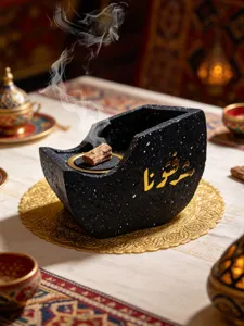 Resin boat-shaped incense burner detail with Arabic calligraphy, ideal for home decor aromatherapy.