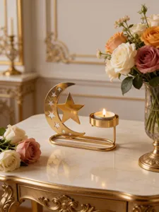 Close-up detail of the elegant gold crescent moon candle holder showcasing festive tabletop decor.