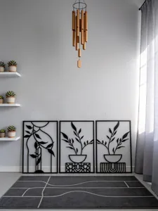 Modern metal wall art decor and wooden wind chime set for stylish home interior decoration.