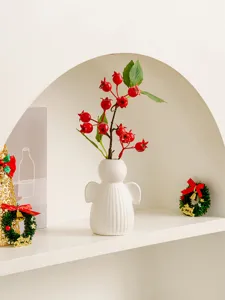 White ceramic angel vase desktop ornament with artificial red berry branches for home decor details