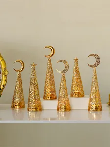 Gold metal hollow cone candle holder with star moon top detail for festive holiday decor.