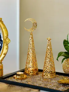 Exquisite gold metal hollowed candle holder with moon and star, elegant holiday home decor.