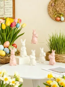 Easter ceramic rabbit figurines set, cute bow tie egg holding bunnies for spring home decor.