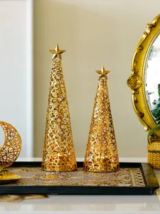 Gold metal Christmas tree candle holder detail, luxury hollow-out festive desktop decor.