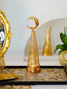 Exquisite gold metal cutout candle holder with crescent moon design for home and holiday decor.