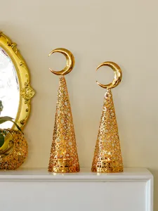Gold metal cone candle holder with crescent moon top and hollow mesh design for home decor.