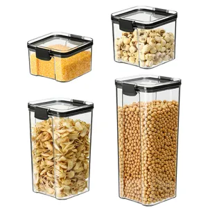 Set of 4 square transparent food storage jars with airtight black lids for kitchen grain.