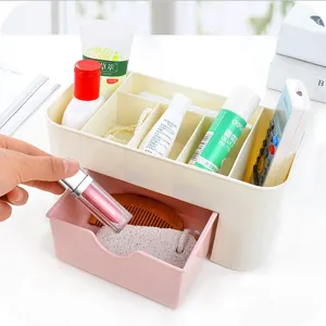 Plastic desktop storage box with drawers and compartments for cosmetics and supplies.