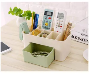 Plastic desktop storage box with drawer for cosmetics, stationery and jewelry organization.