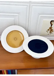 Modern minimalist ceramic cake plate with radial textured rim and elegant color center detail