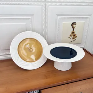 Modern minimalist ceramic cake stand set with ray pattern, elegant dessert and fruit plates.