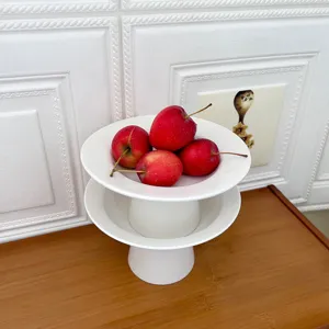 Modern minimalist white ceramic high pedestal fruit plate dessert tray for living room table.