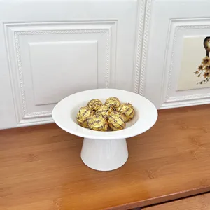 Modern minimalist white ceramic footed fruit plate, elegant desktop dessert tray for home.