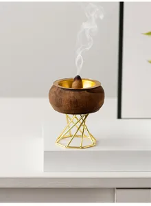 Minimalist wooden incense burner with gold geometric stand for home decor meditation.