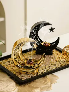 Middle Eastern metal crescent incense burner detail view, hollow aromatherapy holder decor.