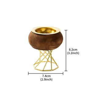 Wooden aromatherapy incense burner with golden metal octagonal base, elegant home decor piece.
