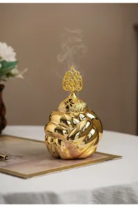 Modern minimalist ceramic yarn ball incense burner with gold finish home decor aromatherapy.