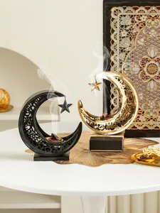 Metal crescent moon incense burner set, elegant hollow out design for home decor table.