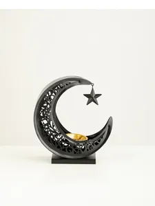 Detailed view of Middle Eastern metal crescent moon incense burner with hanging star and gold bowl.