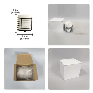 Detailed view of the white ceramic makeup brush holder with black wire frame and packaging box.