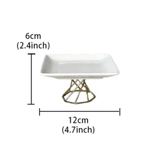 Modern minimalist ceramic jewelry tray with gold geometric stand, white desktop storage dish.