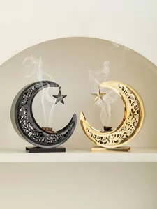 Exquisite metal crescent incense burner with hollow pattern, elegant desktop decor.