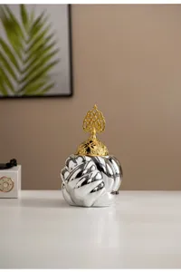 Detailed close-up shot of the modern ceramic yarn ball censer featuring a delicate golden lid.