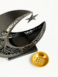 Detailed view of the metal crescent incense burner, Middle Eastern style tabletop decor.