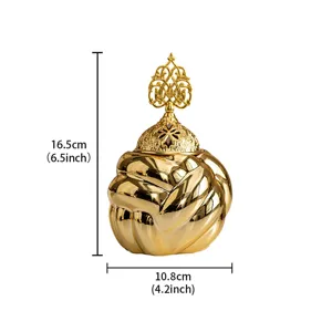 Gold ceramic yarn ball incense burner detail with ornate tree top lid showing size specs.