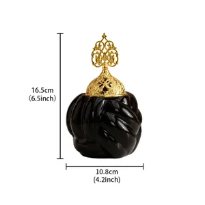 Modern minimalist ceramic incense burner with gold hollow lid, elegant home aromatherapy furnace.