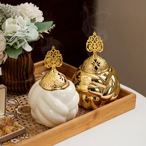 Modern ceramic incense burner with gold lid, elegant aroma diffuser for living room decor.