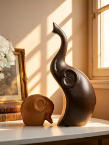 Ceramic elephant figurine detail showcasing smooth curves and warm tones for home decor.